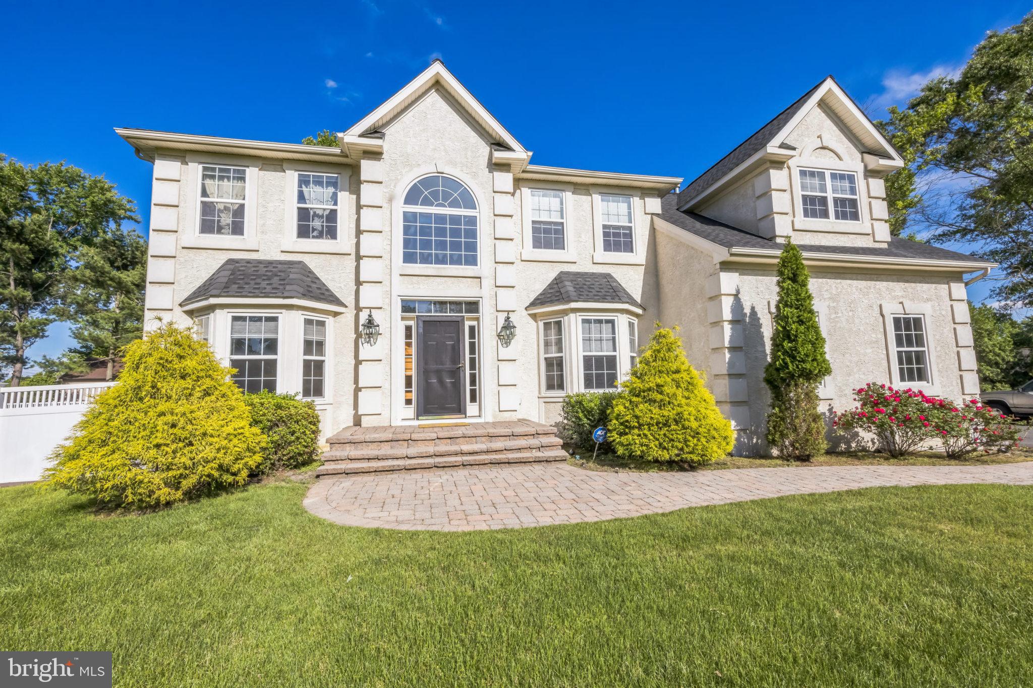 1 Elmwood Road Mount Laurel, NJ 08054 - Photo 5 of 44 a front view of a house with a garden