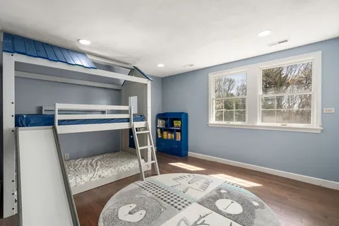 a bedroom with furniture and a window