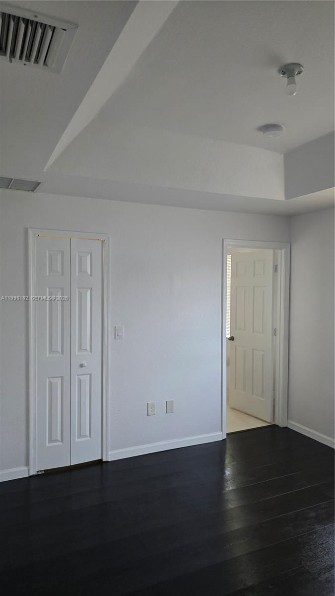 2755 Southeast 15th Road, Unit 101 Homestead, FL 33035 - Photo 12 of 18 an empty room with wooden floor