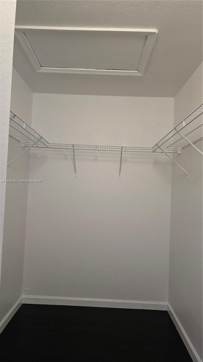 2755 Southeast 15th Road, Unit 101 Homestead, FL 33035 - Photo 13 of 18 a view of an empty walk in closet