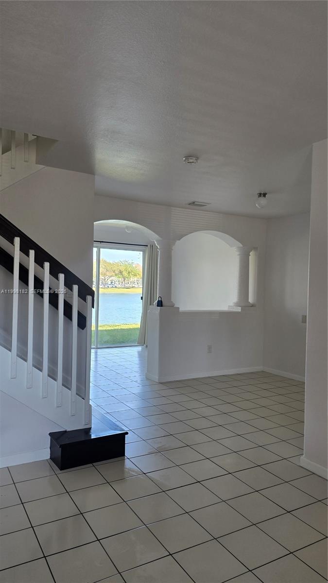 2755 Southeast 15th Road, Unit 101 Homestead, FL 33035 - Photo 4 of 18 a view of entryway with wooden floor