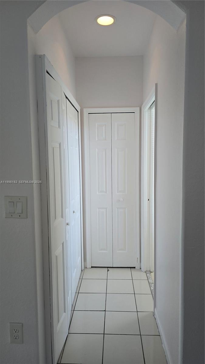2755 Southeast 15th Road, Unit 101 Homestead, FL 33035 - Photo 5 of 18 a view of a hallway