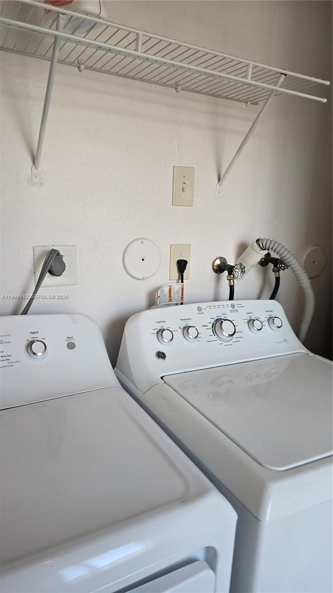 2755 Southeast 15th Road, Unit 101 Homestead, FL 33035 - Photo 6 of 18 a utility room with dryer and washer
