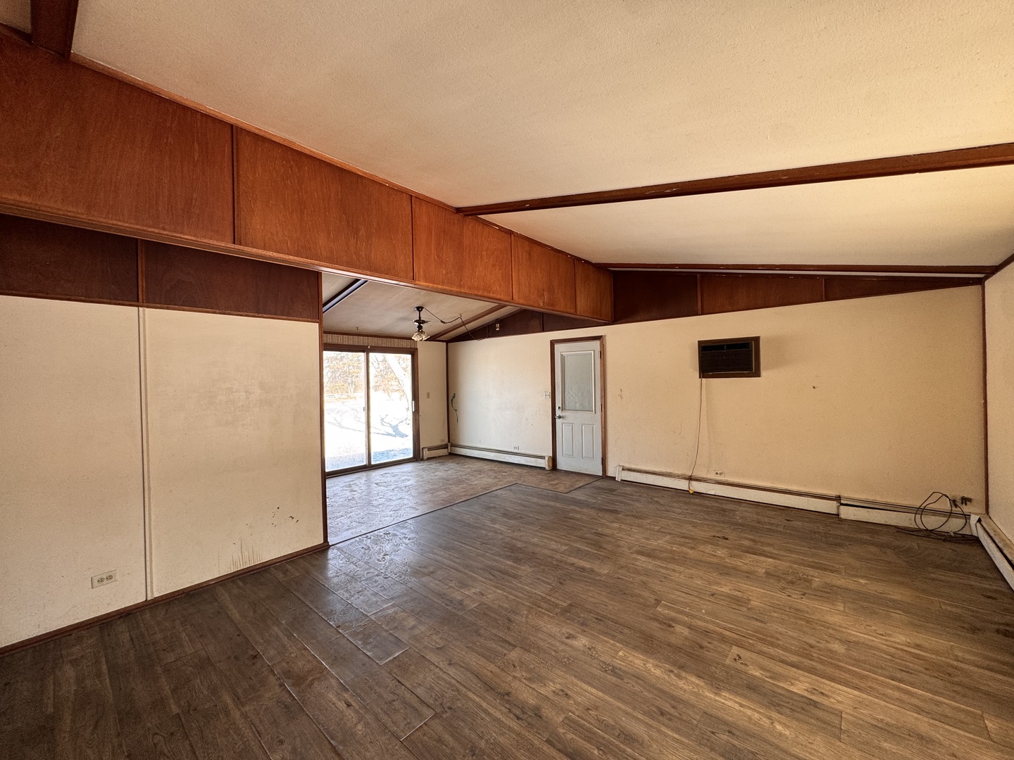 806 Northeast 3rd Street Galva, IL 61434 - Photo 5 of 20 an empty room with wooden floor and windows