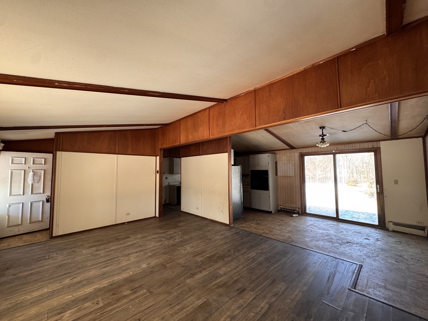 806 Northeast 3rd Street Galva, IL 61434 - Photo 6 of 20 a view of a big room with wooden floor and windows