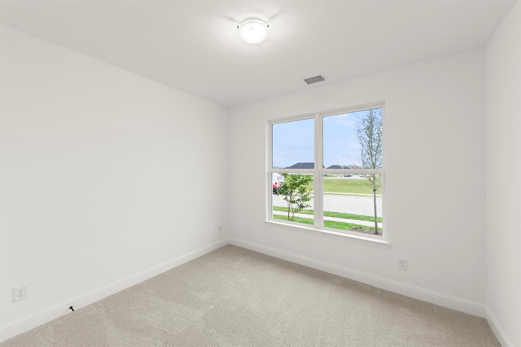 1809 Gleasondale Place Forney, TX 75126 - Photo 15 of 34 an empty room with windows