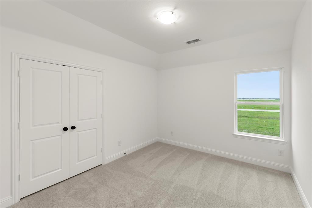 1809 Gleasondale Place Forney, TX 75126 - Photo 17 of 34 an empty room with a window