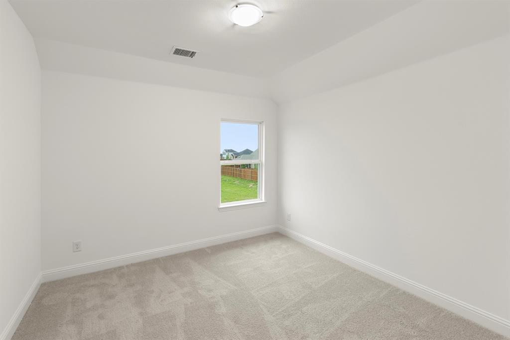 1809 Gleasondale Place Forney, TX 75126 - Photo 18 of 34 an empty room with a window