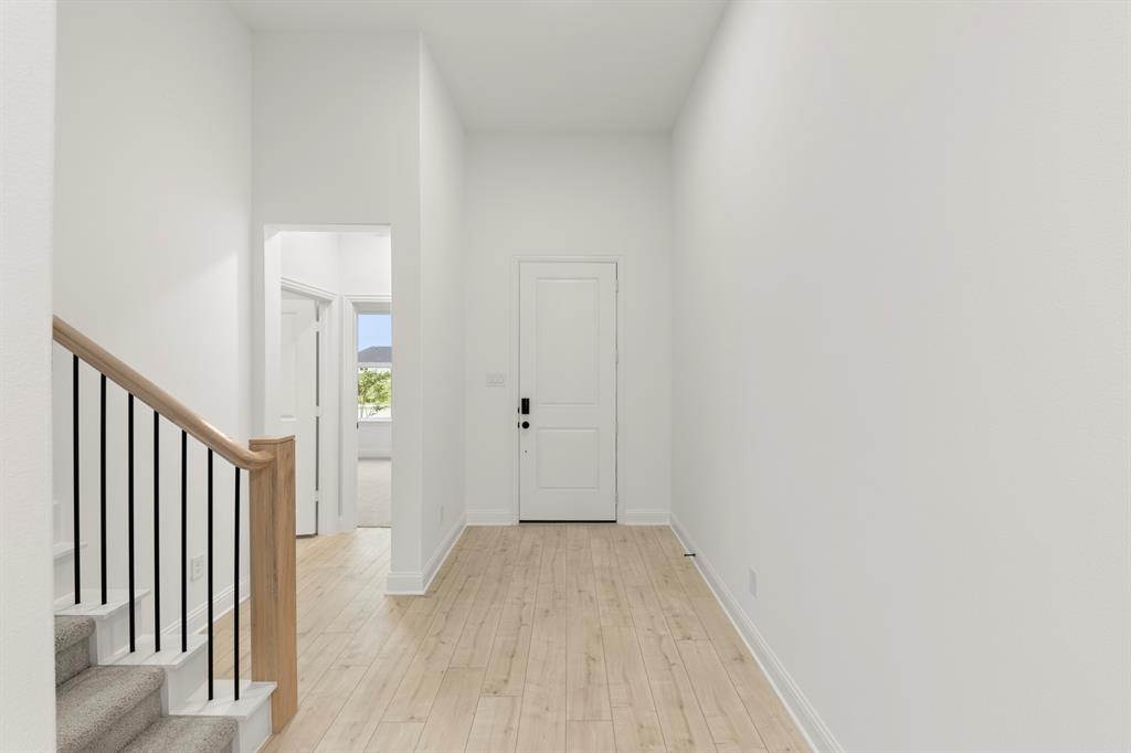 1809 Gleasondale Place Forney, TX 75126 - Photo 22 of 34 a view of a hallway with wooden floor and entryway