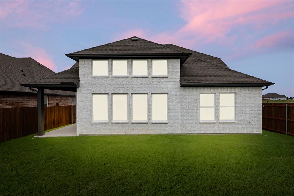 1809 Gleasondale Place Forney, TX 75126 - Photo 25 of 34 a front view of a house with a garden