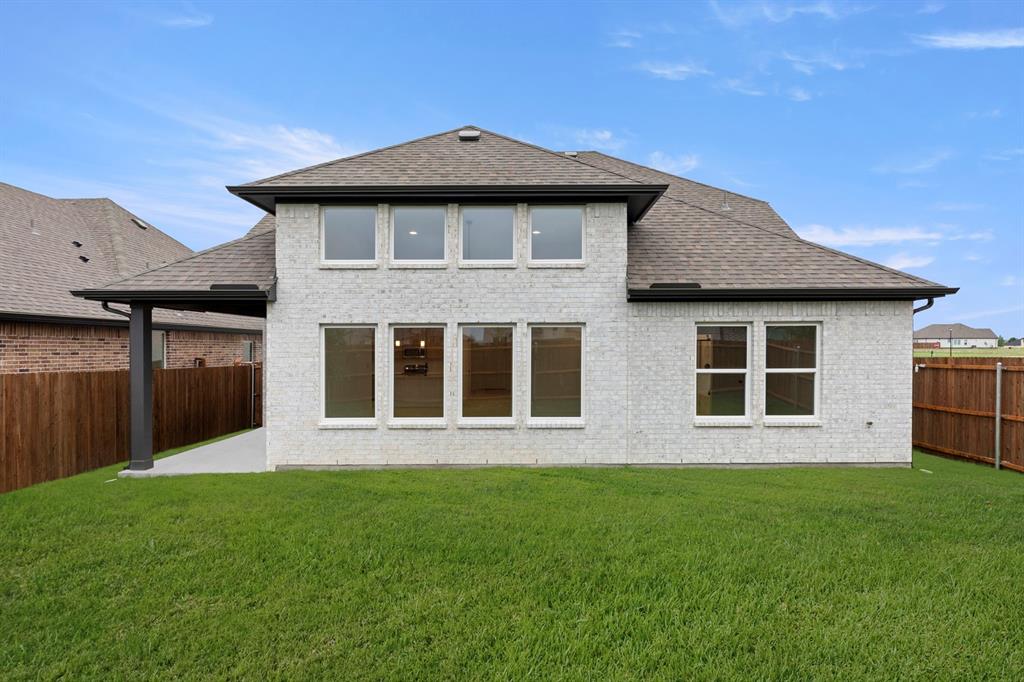 1809 Gleasondale Place Forney, TX 75126 - Photo 26 of 34 a front view of a house with a garden