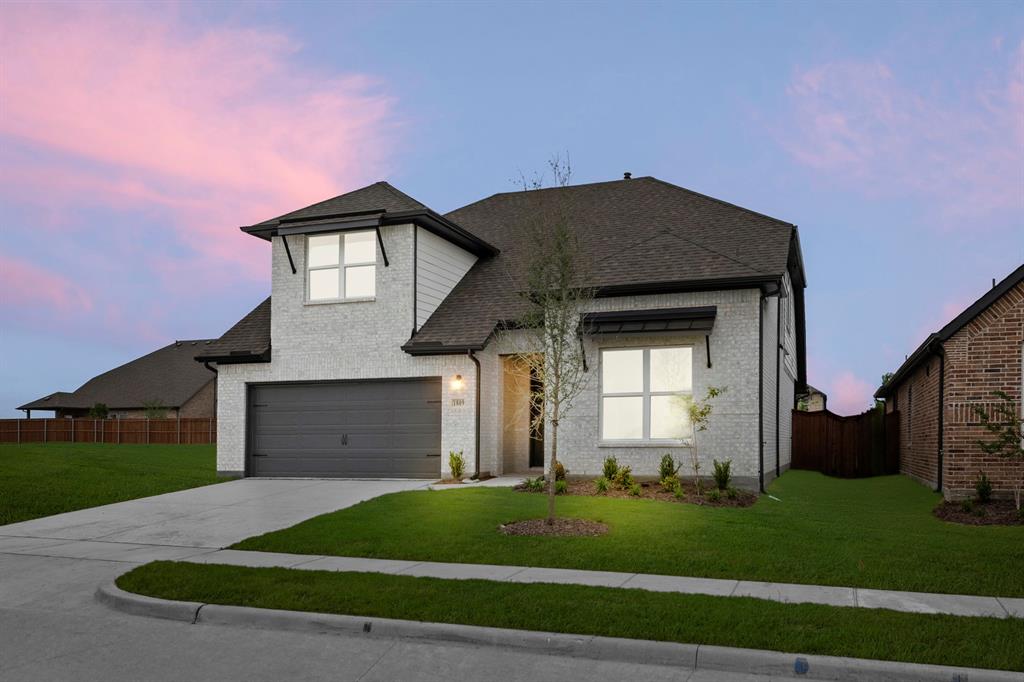 1809 Gleasondale Place Forney, TX 75126 - Photo 28 of 34 a front view of a house with a yard and garage