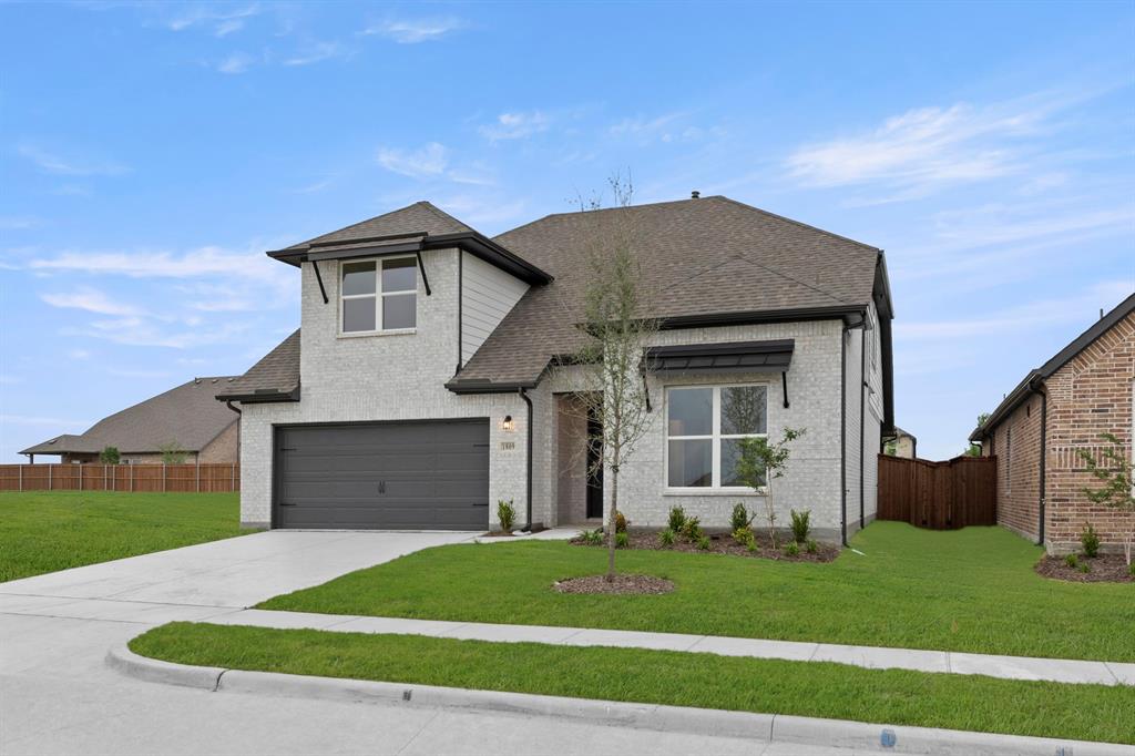 1809 Gleasondale Place Forney, TX 75126 - Photo 29 of 34 a front view of a house with a garden and yard