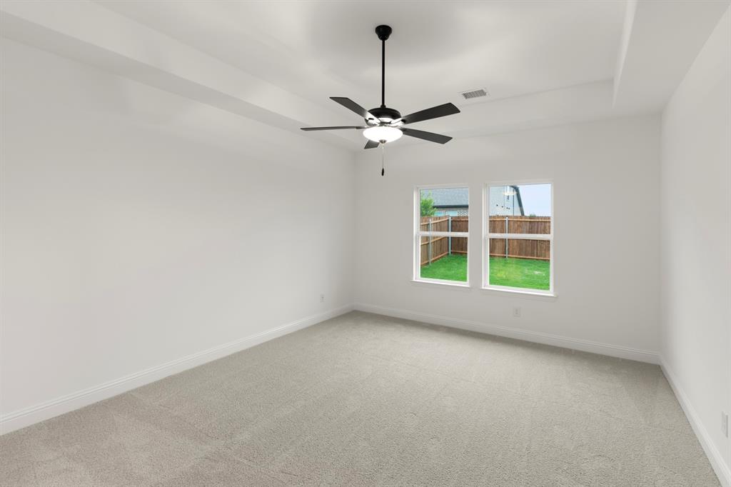 1809 Gleasondale Place Forney, TX 75126 - Photo 9 of 34 a view of room with a ceiling fan and window