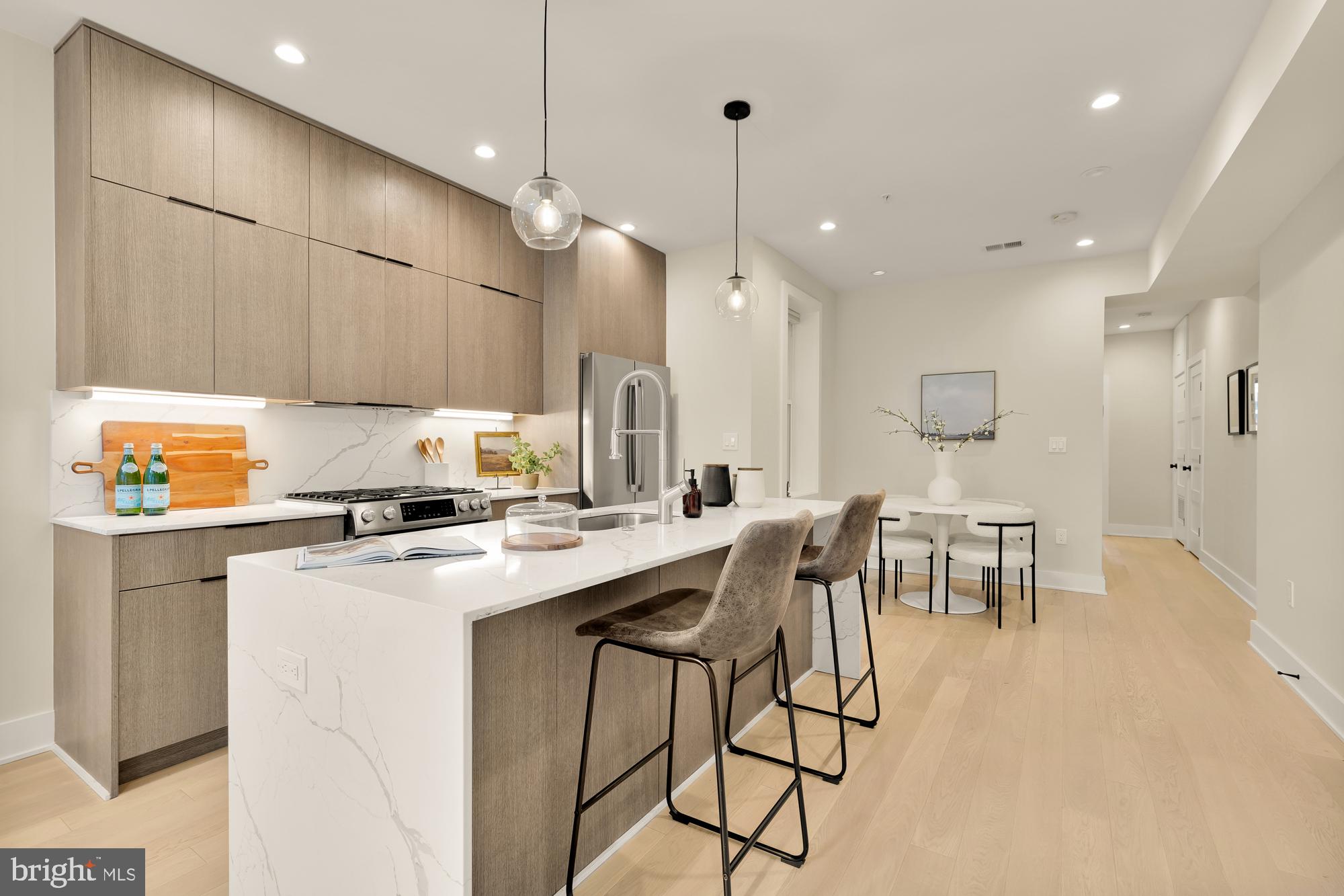 1747 T Street Northwest, Unit 4 Washington, DC 20009 - Photo 8 of 30 Calacatta Quartz countertops with waterfall edges