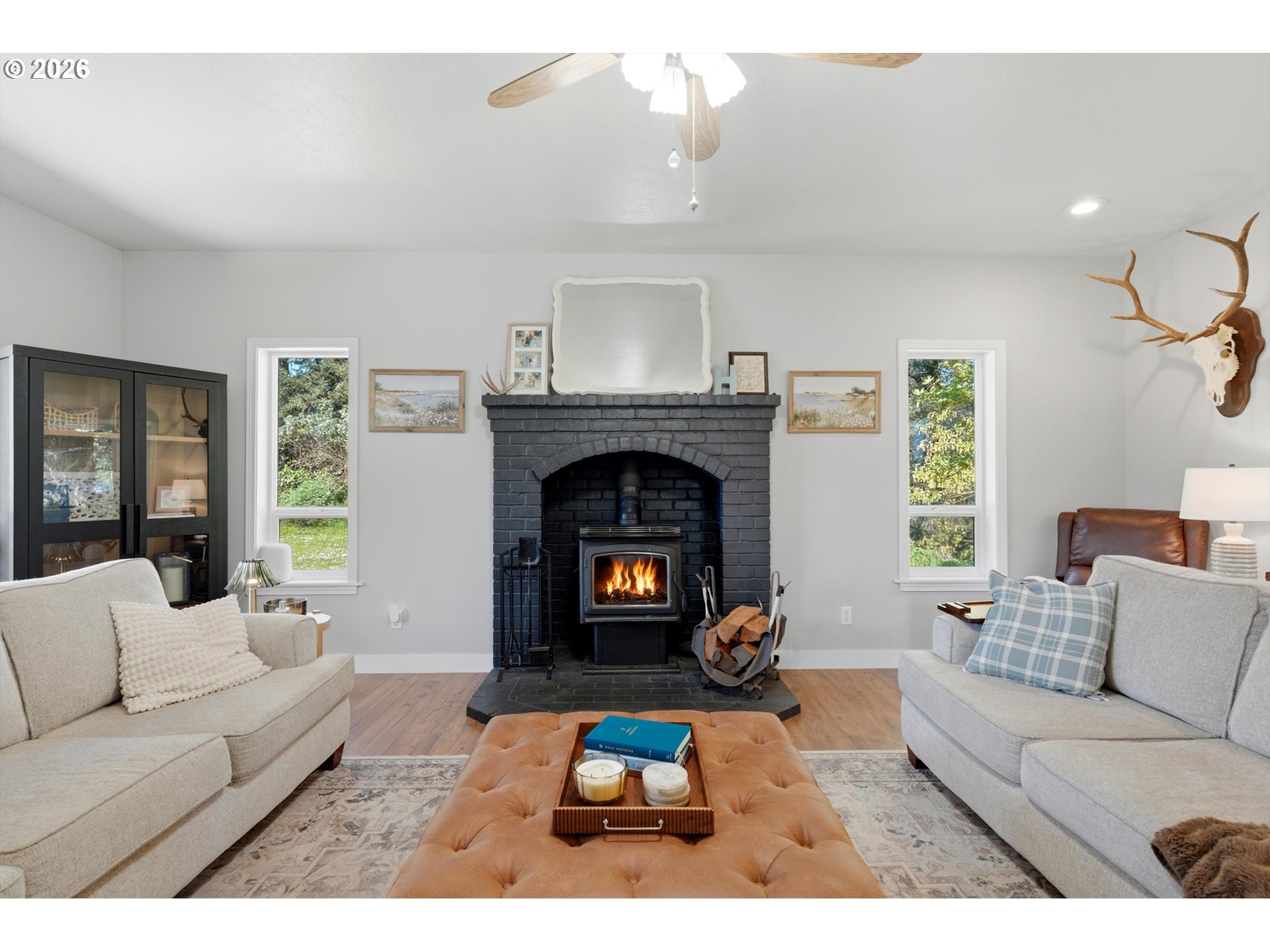 23032 Northeast Hagey Road Dundee, OR 97115 - Photo 6 of 42 a living room with furniture and a fireplace