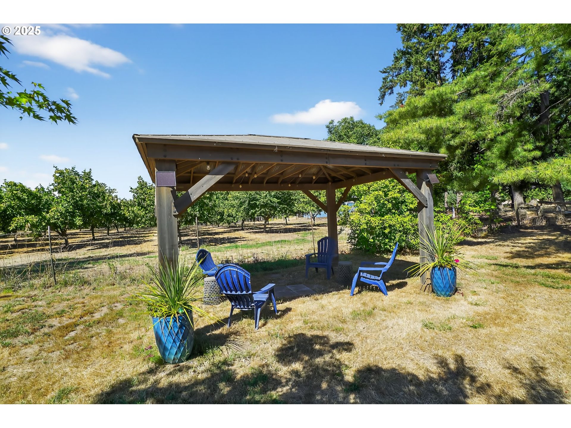 8487 South Sconce Road Canby, OR 97013 - Photo 25 of 27 a view of back yard with wooden floor and outdoor seating