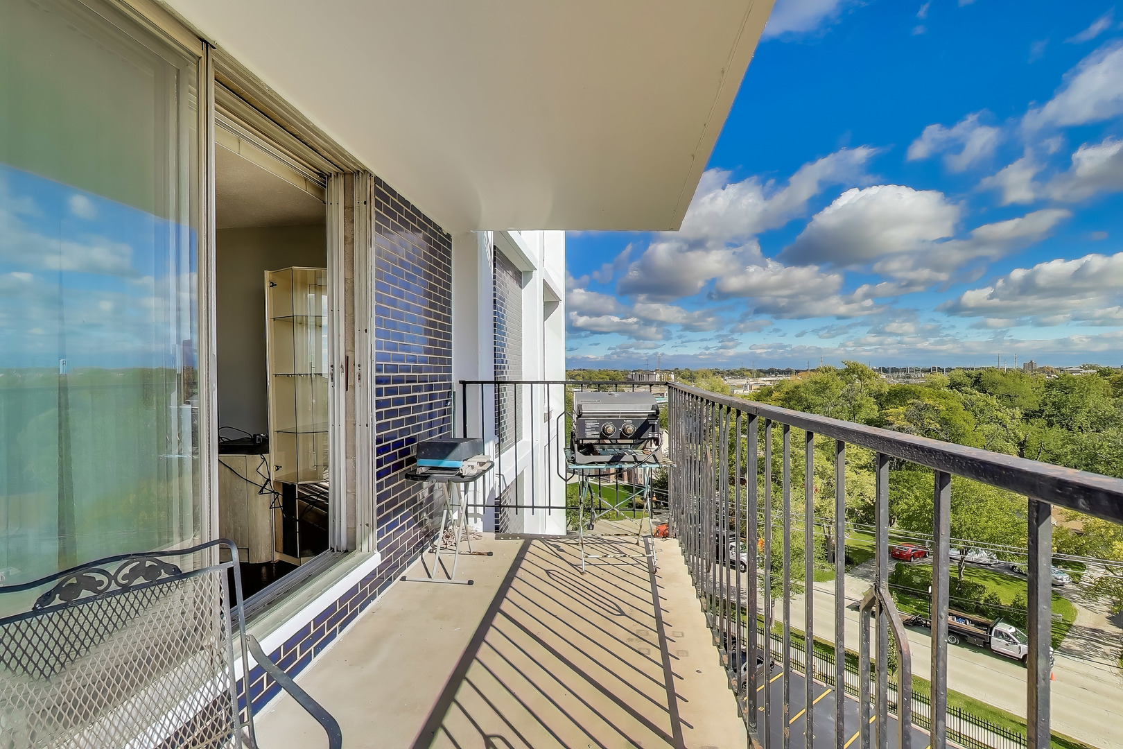 8809 West Golf Road, Unit 8I Niles, IL 60714 - Photo 11 of 27 a view of balcony with wooden floor