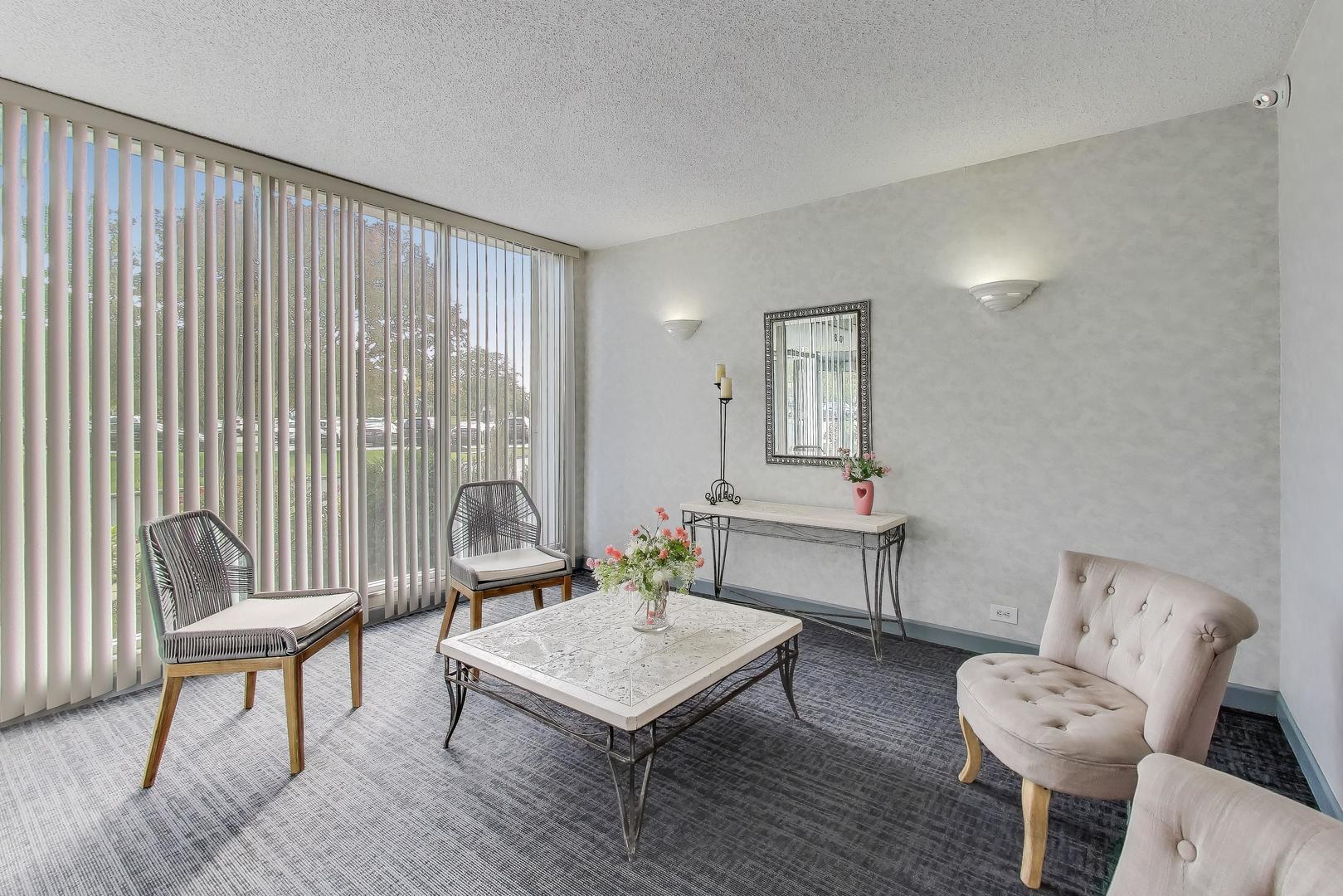8809 West Golf Road, Unit 8I Niles, IL 60714 - Photo 4 of 27 a living room with furniture and a window