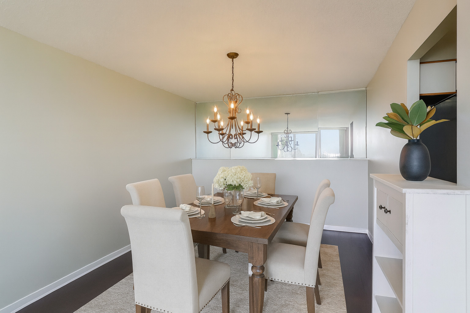 8809 West Golf Road, Unit 8I Niles, IL 60714 - Photo 8 of 27 a view of a dining room with furniture and chandelier