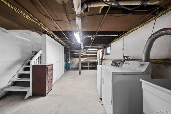 a view of storage and utility room with stairs
