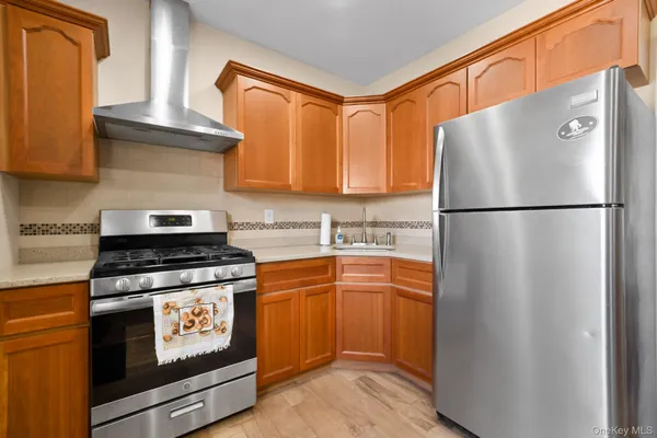 a white refrigerator freezer and a stove top oven