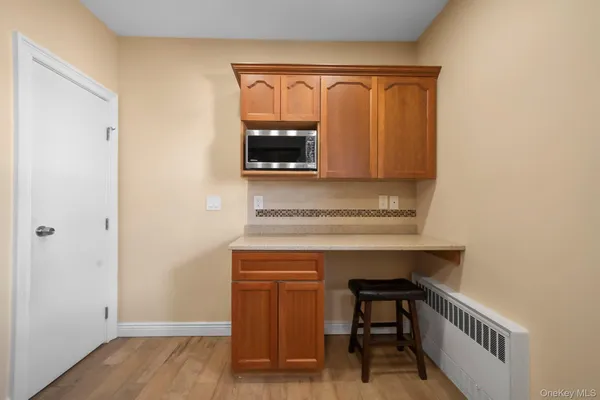 a room with a bench and a window