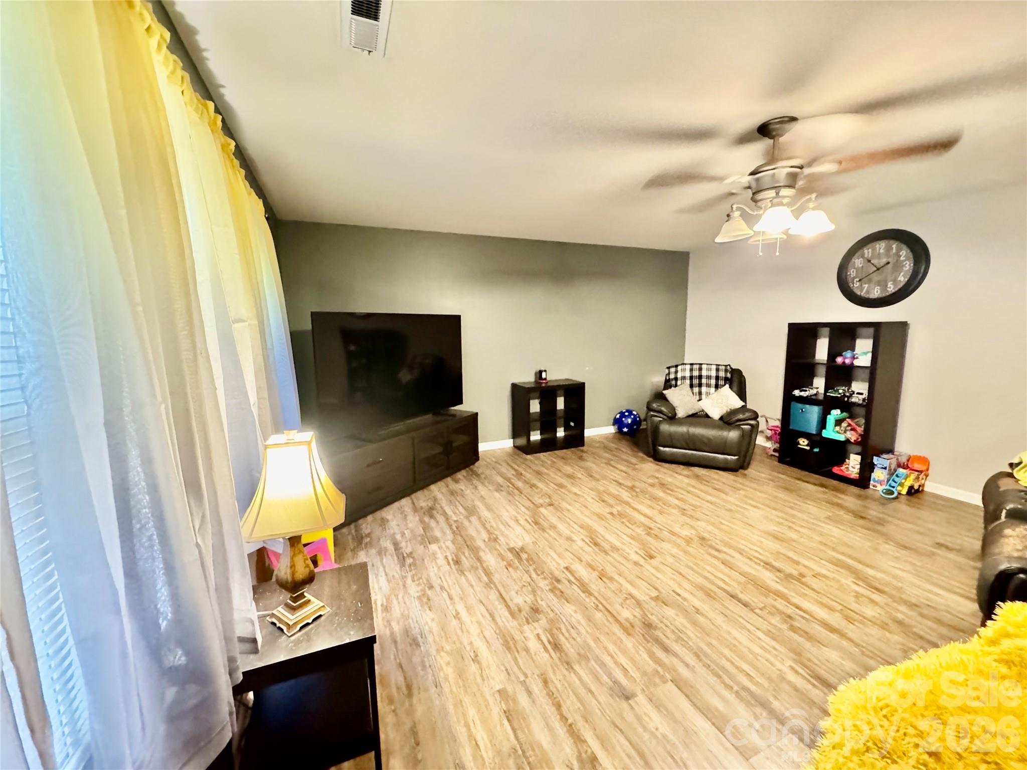658 Buckskin Road Oakboro, NC 28129 - Photo 20 of 30 a bedroom with a bed and a flat tv screen on dresser