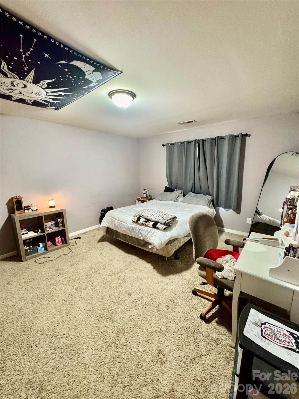 658 Buckskin Road Oakboro, NC 28129 - Photo 29 of 30 a bed room with a bed and a chair