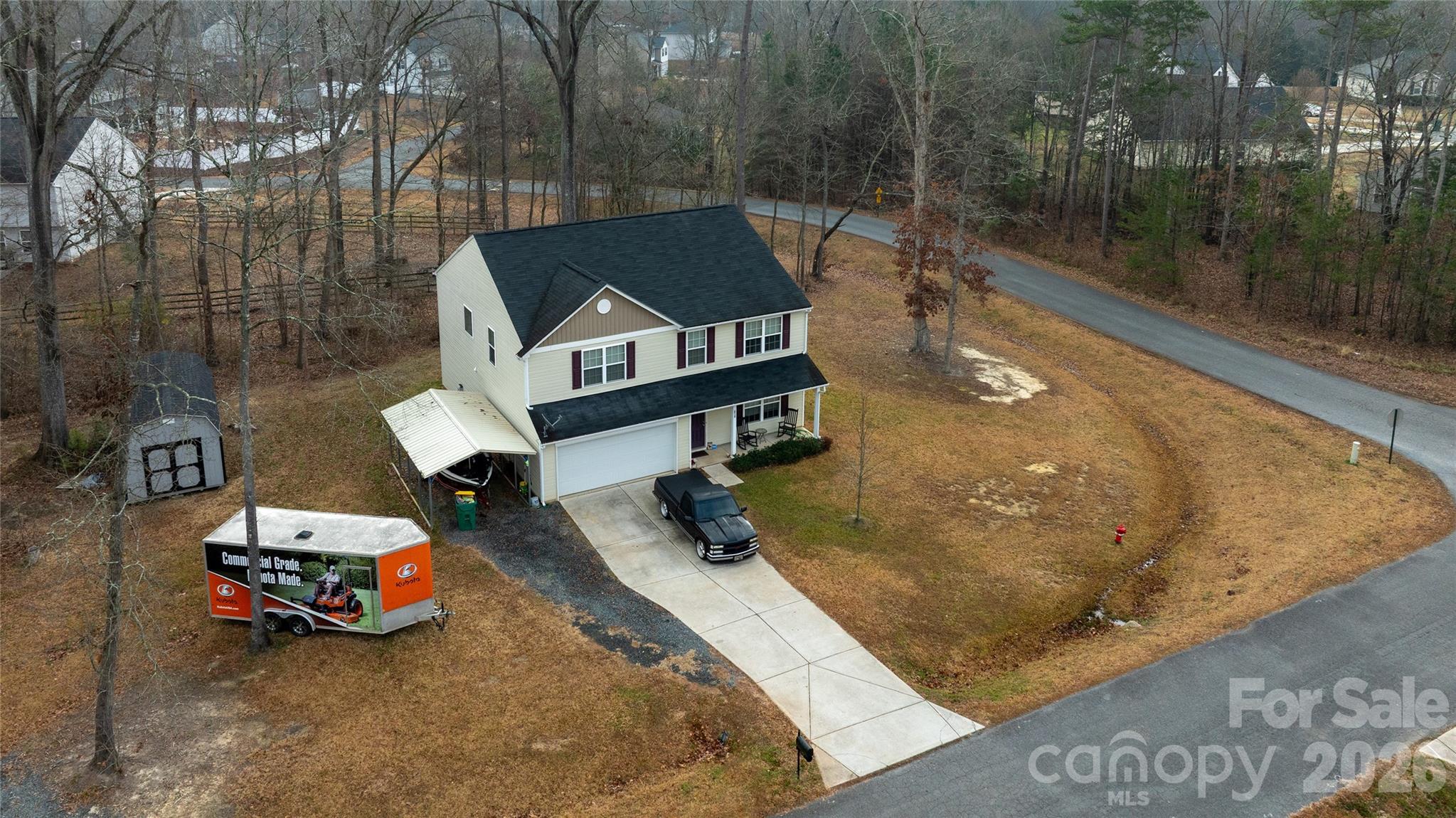 658 Buckskin Road Oakboro, NC 28129 - Photo 6 of 30 a view of a backyard with table and chairs