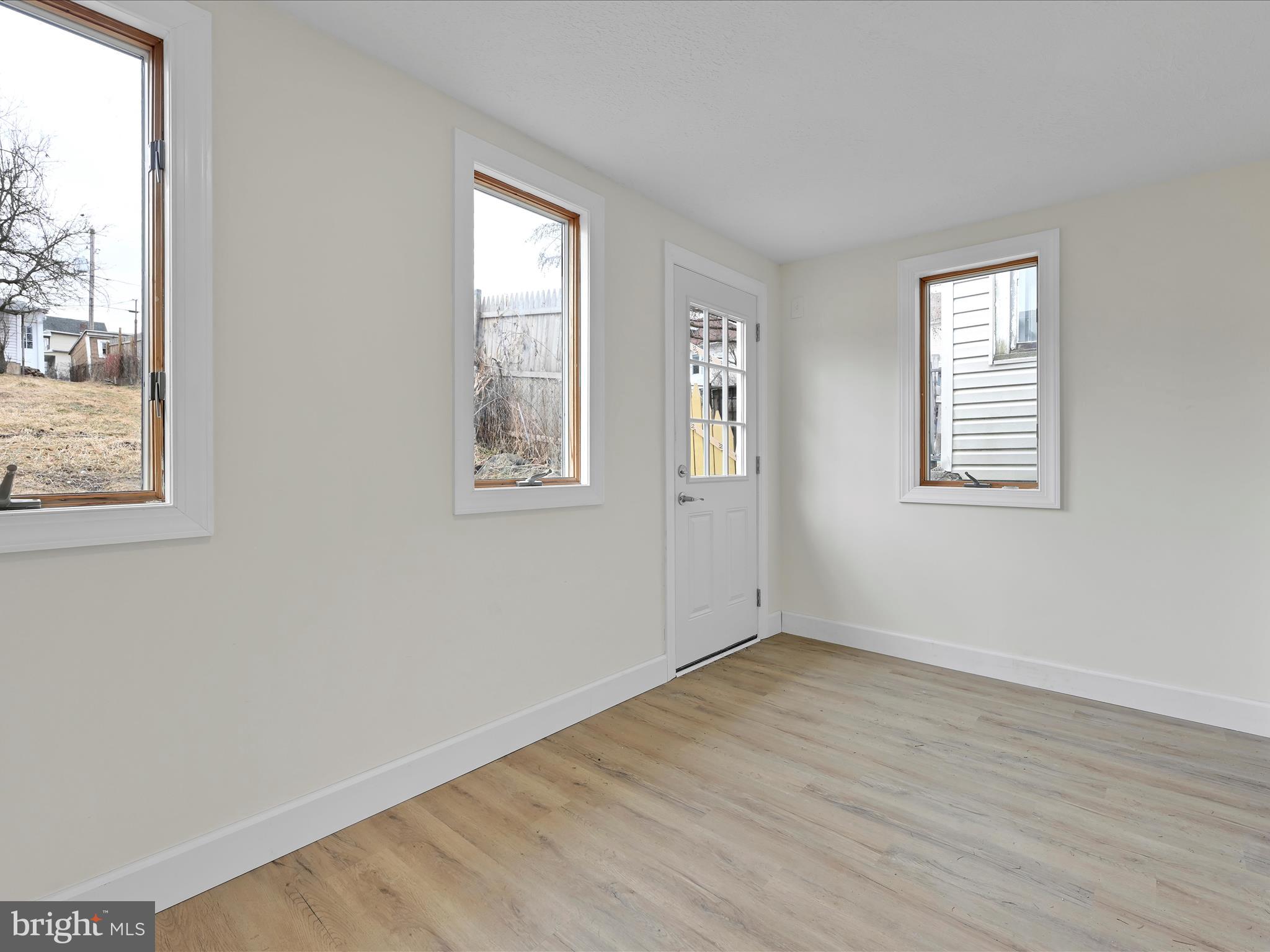 142 West Ruddle Street Coaldale, PA 18218 - Photo 11 of 28 a view of an empty room with wooden floor and a window