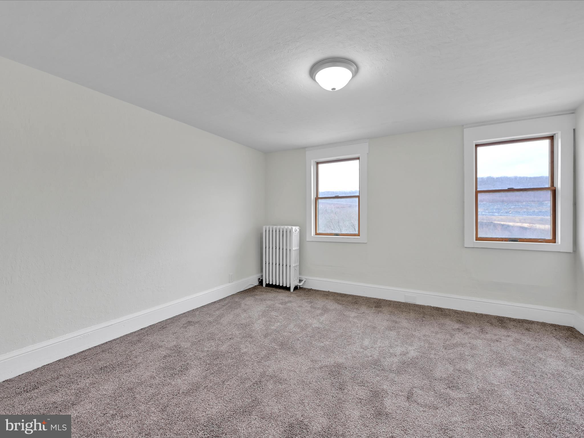 142 West Ruddle Street Coaldale, PA 18218 - Photo 14 of 28 an empty room with windows