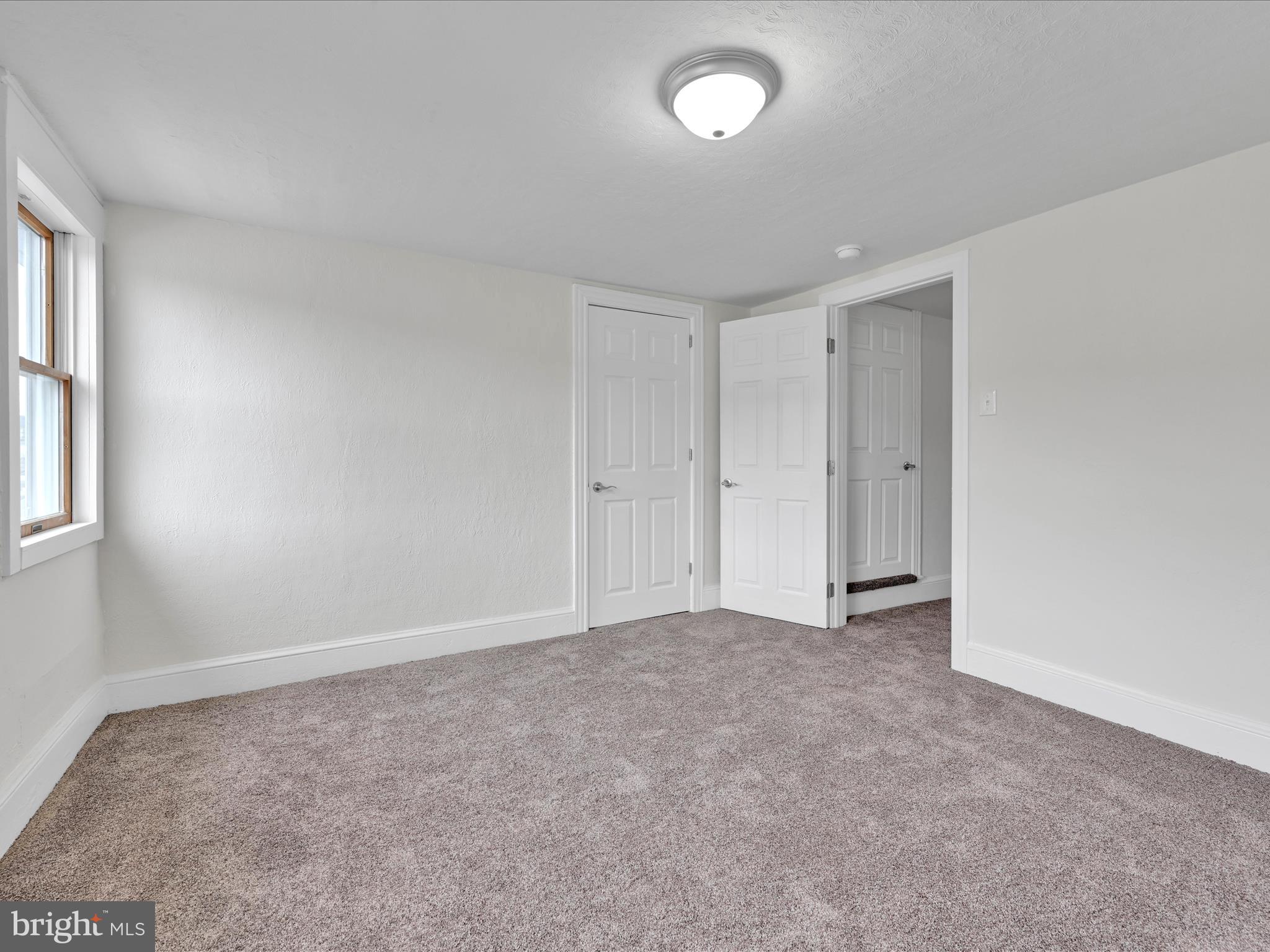 142 West Ruddle Street Coaldale, PA 18218 - Photo 15 of 28 an empty room with windows