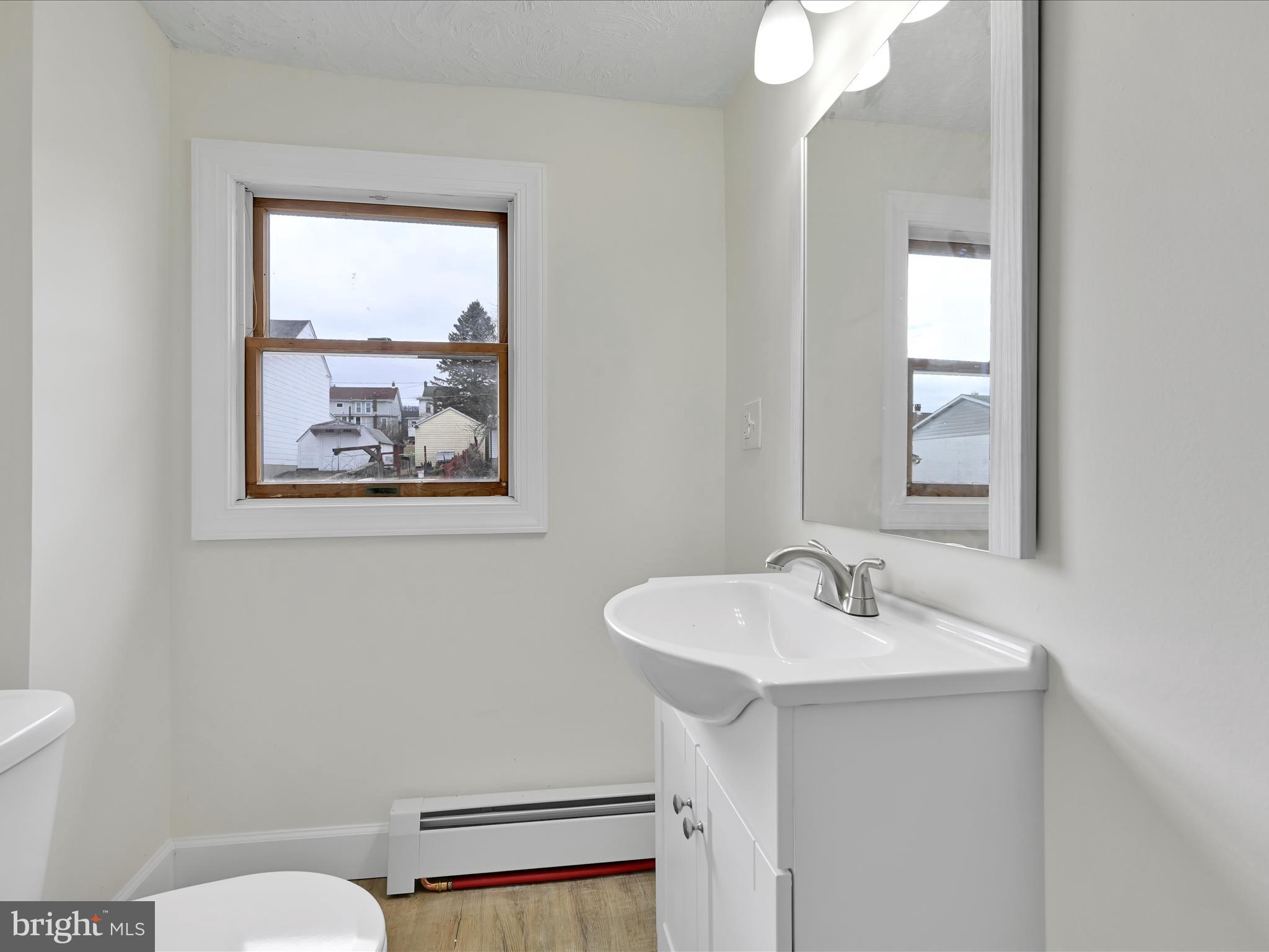 142 West Ruddle Street Coaldale, PA 18218 - Photo 16 of 28 a bathroom with a sink mirror and toilet