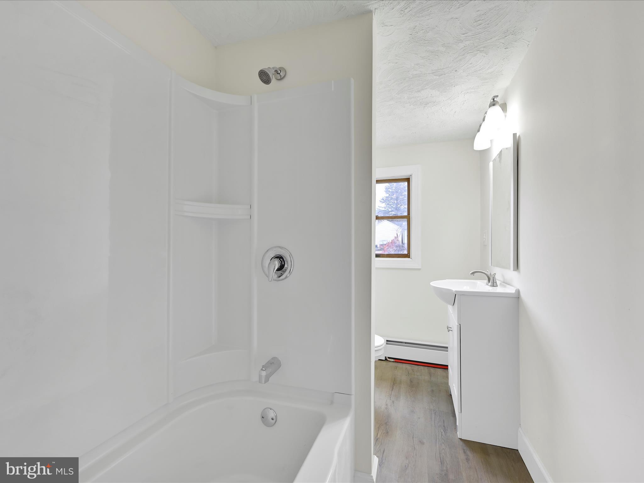 142 West Ruddle Street Coaldale, PA 18218 - Photo 17 of 28 a bathroom with a bathtub and a shower