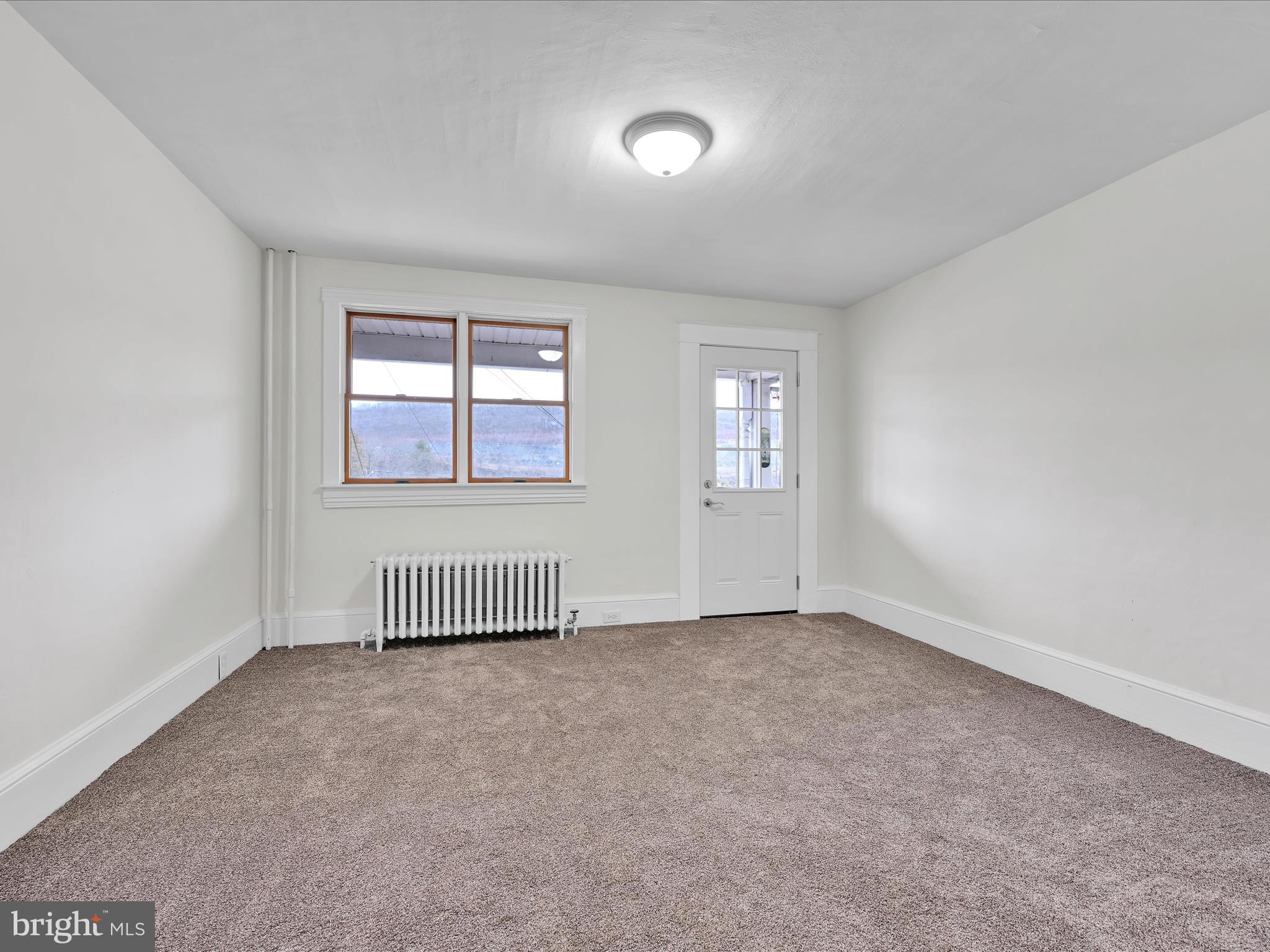 142 West Ruddle Street Coaldale, PA 18218 - Photo 3 of 28 an empty room with windows