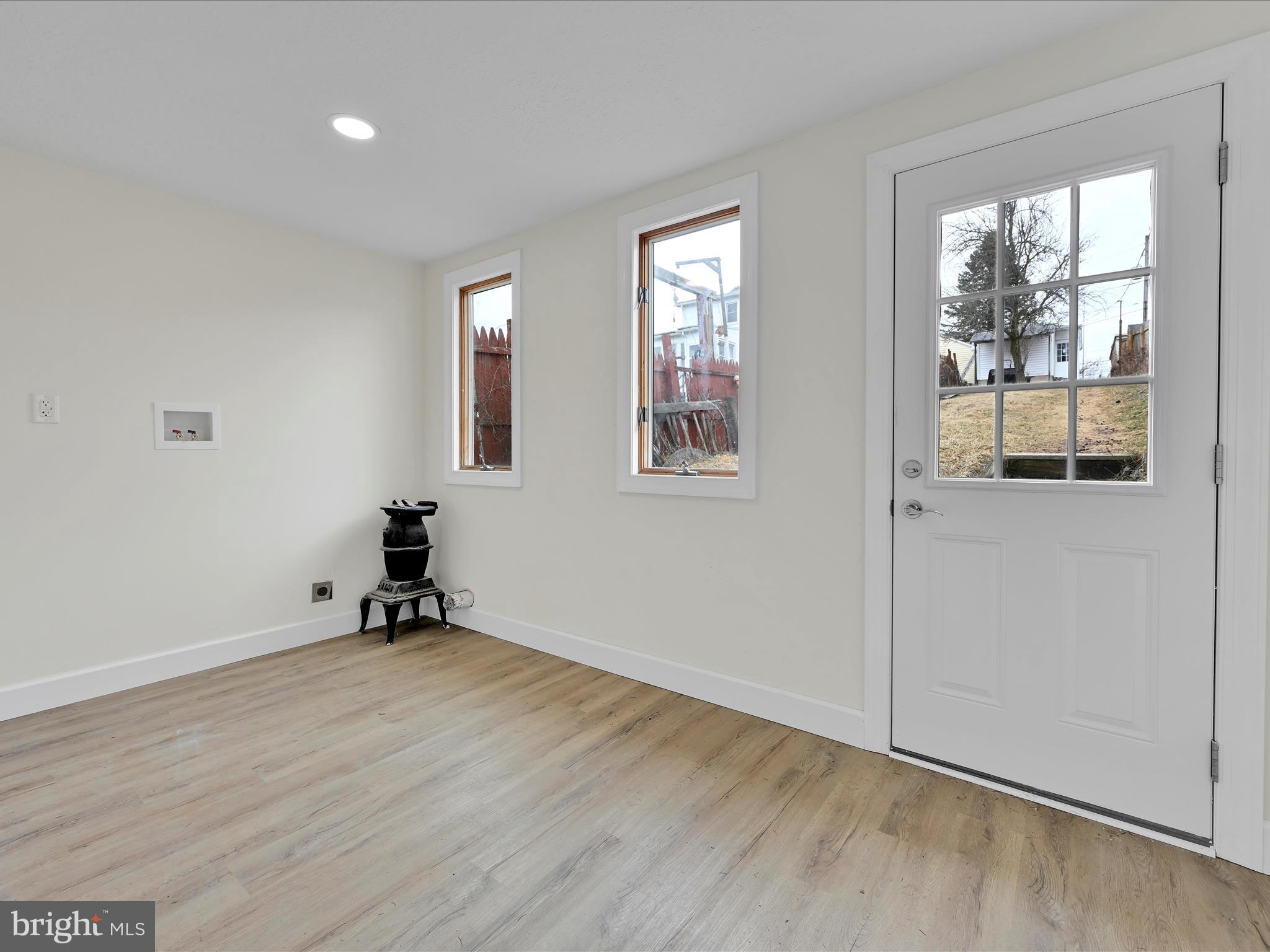 142 West Ruddle Street Coaldale, PA 18218 - Photo 10 of 28 wooden floor in an empty room with a window