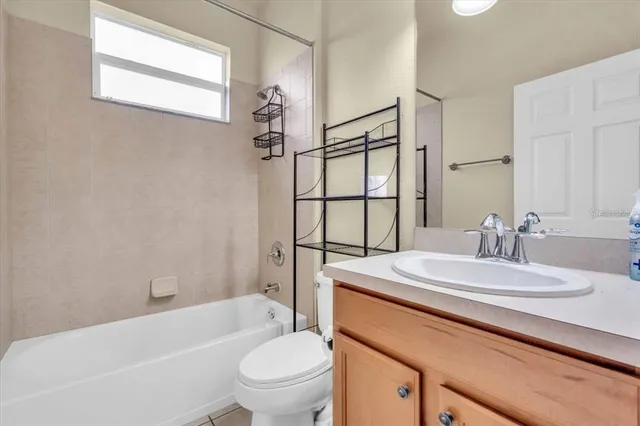 a view of a room with a table and chairs