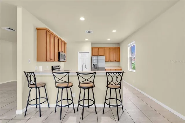 a view of a kitchen and dining room