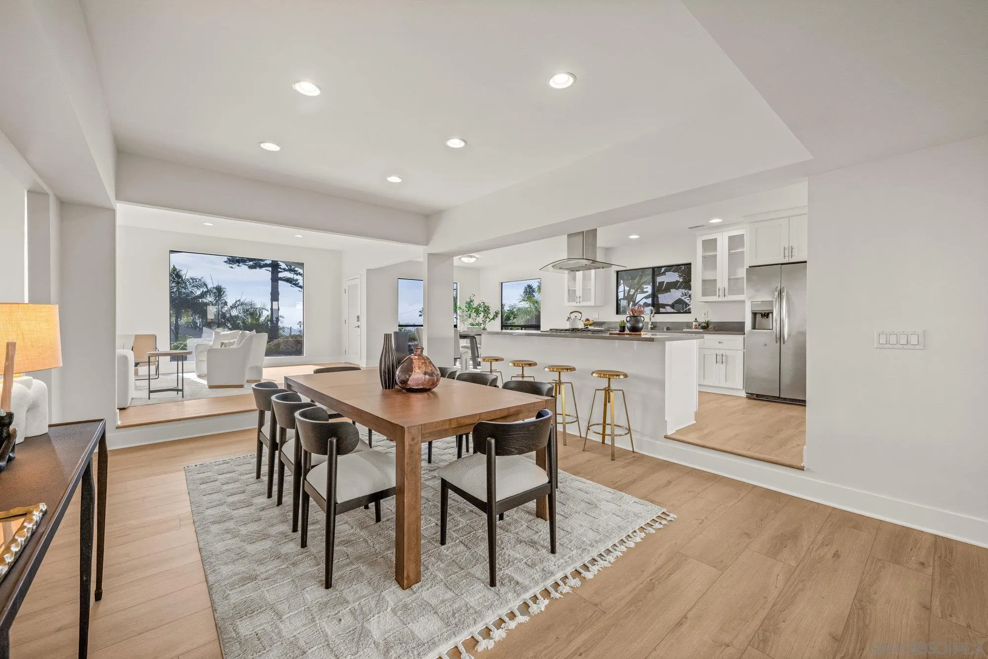 1712 Beryl Street San Diego, CA 92109 - Photo 14 of 37 a view of a dining room with furniture and wooden floor
