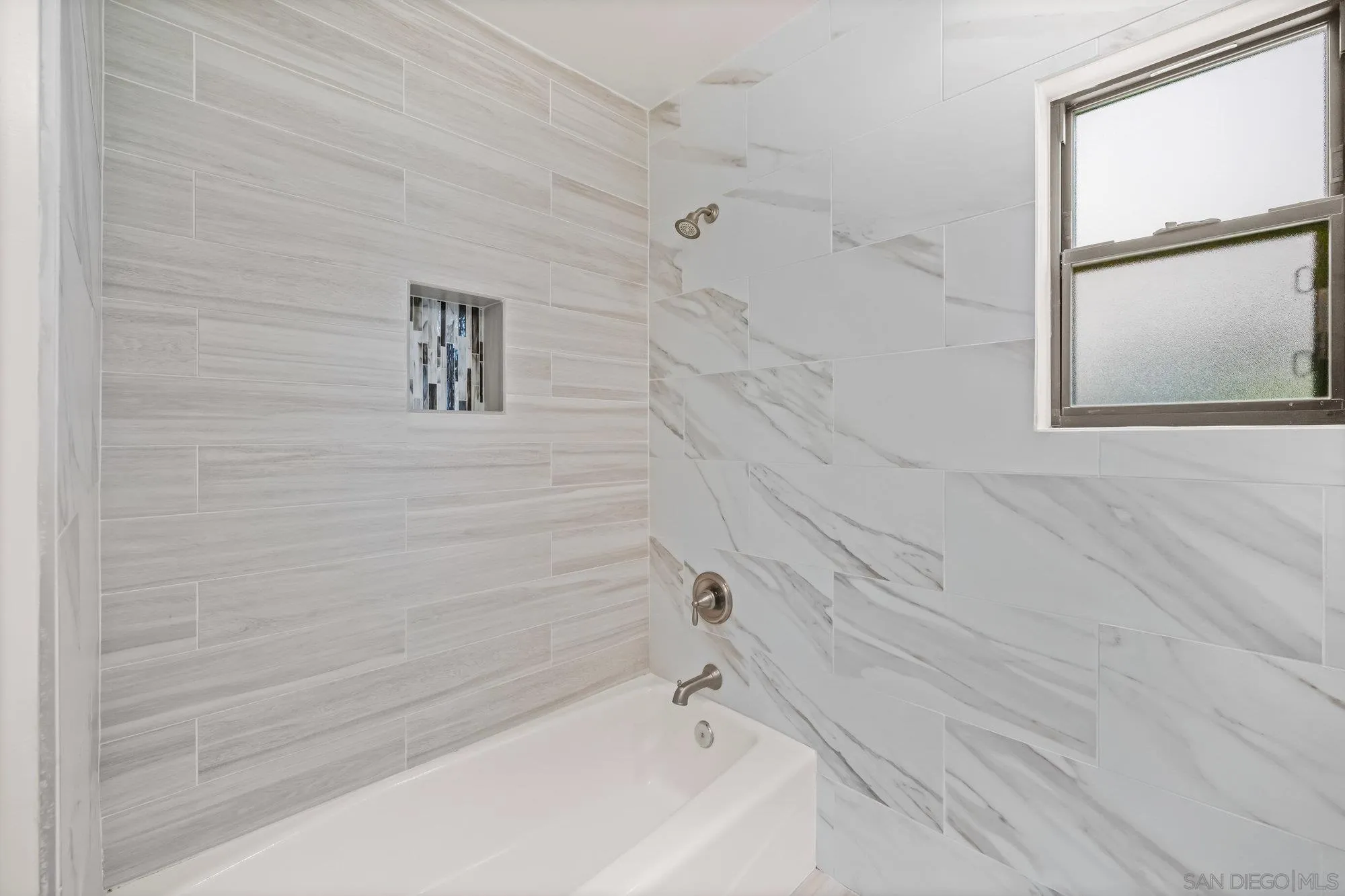 1712 Beryl Street San Diego, CA 92109 - Photo 16 of 37 a bathroom with a bathtub