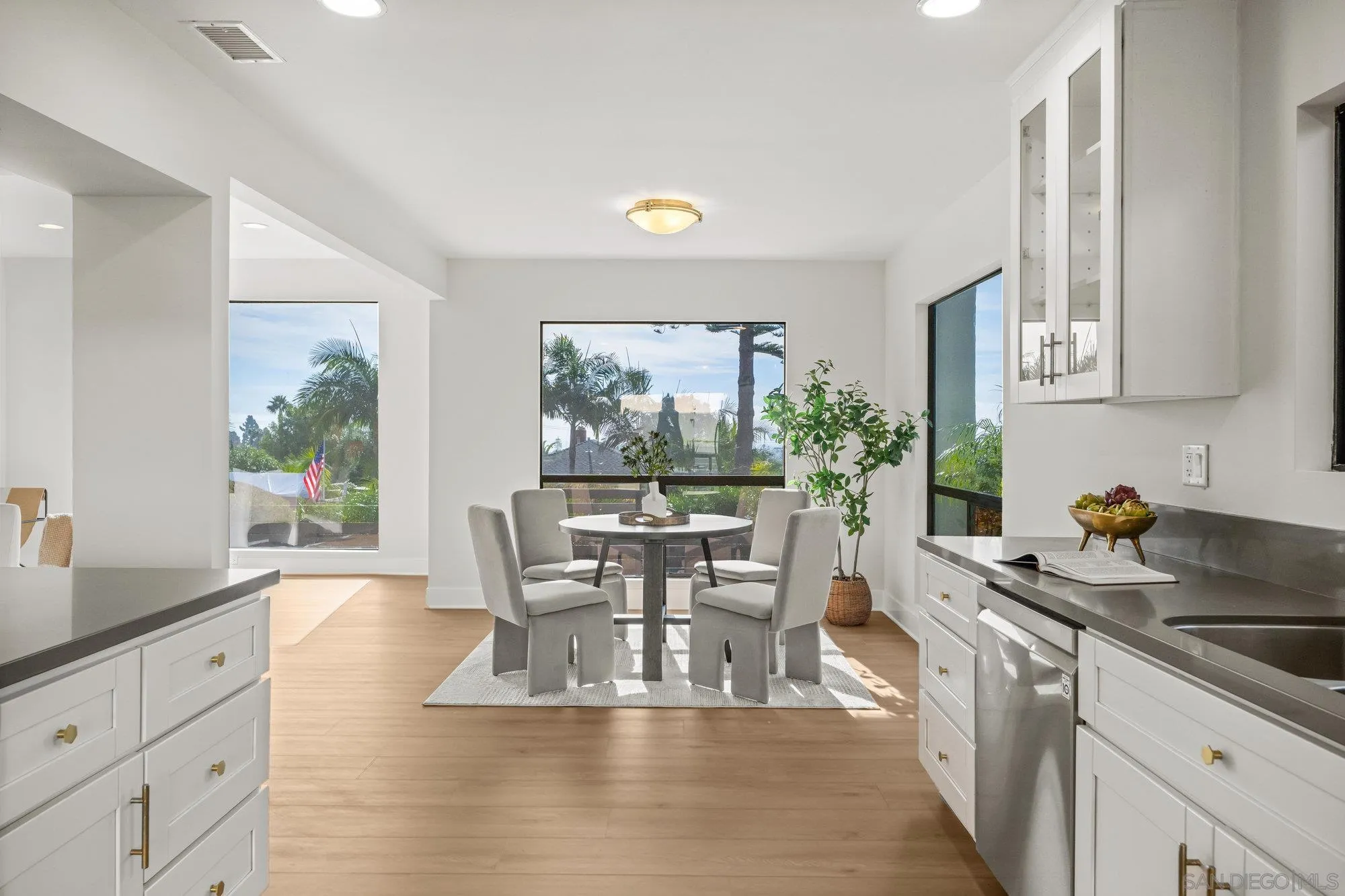 1712 Beryl Street San Diego, CA 92109 - Photo 9 of 37 a dining room with furniture a large window and wooden floor