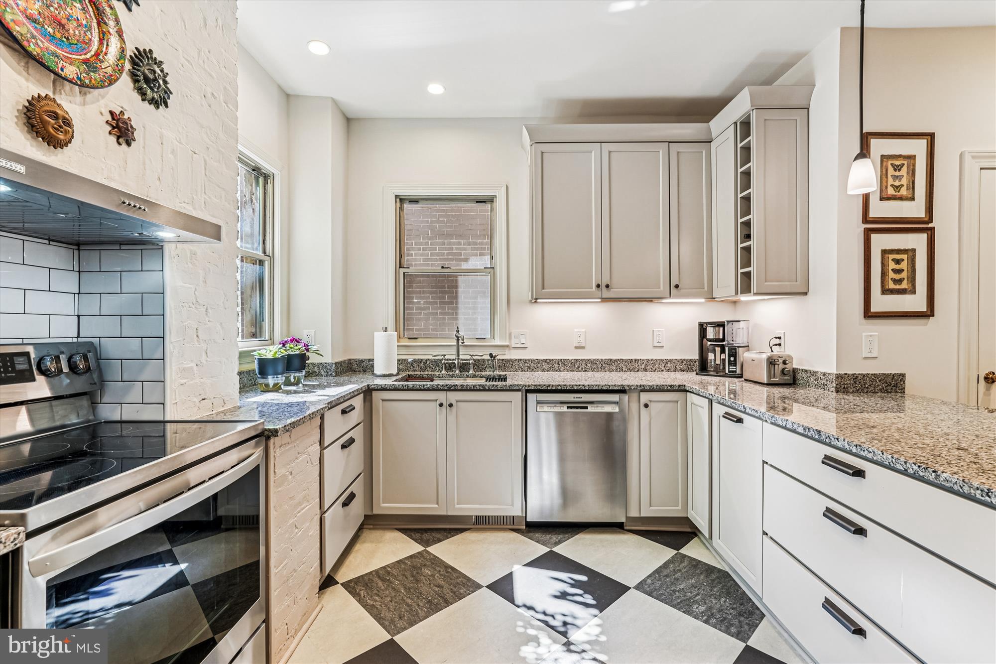 1420 Q Street Northwest Washington, DC 20009 - Photo 13 of 86 a kitchen with a sink stove and cabinets