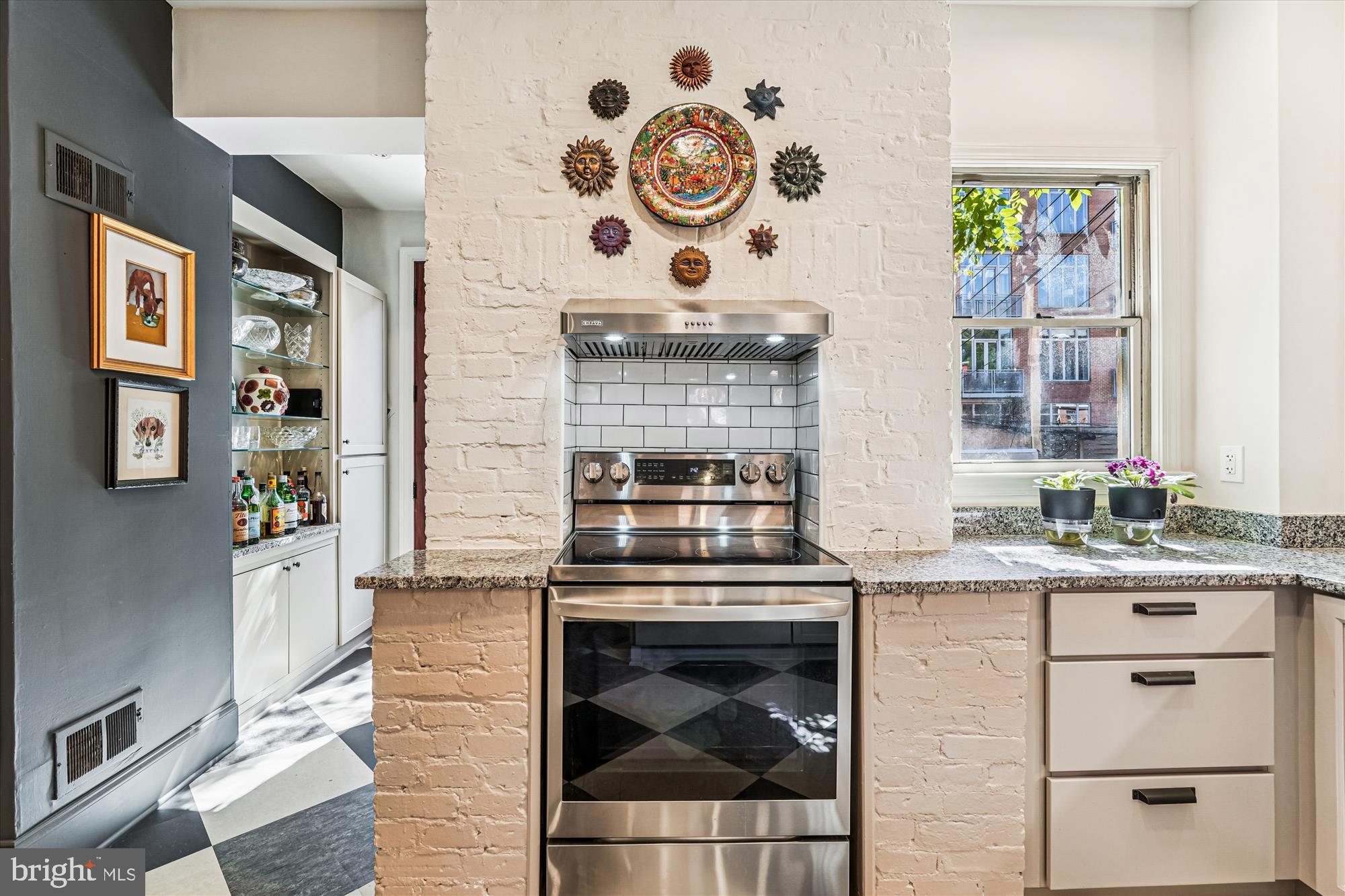 1420 Q Street Northwest Washington, DC 20009 - Photo 17 of 86 a kitchen with stainless steel appliances granite countertop a stove and a sink