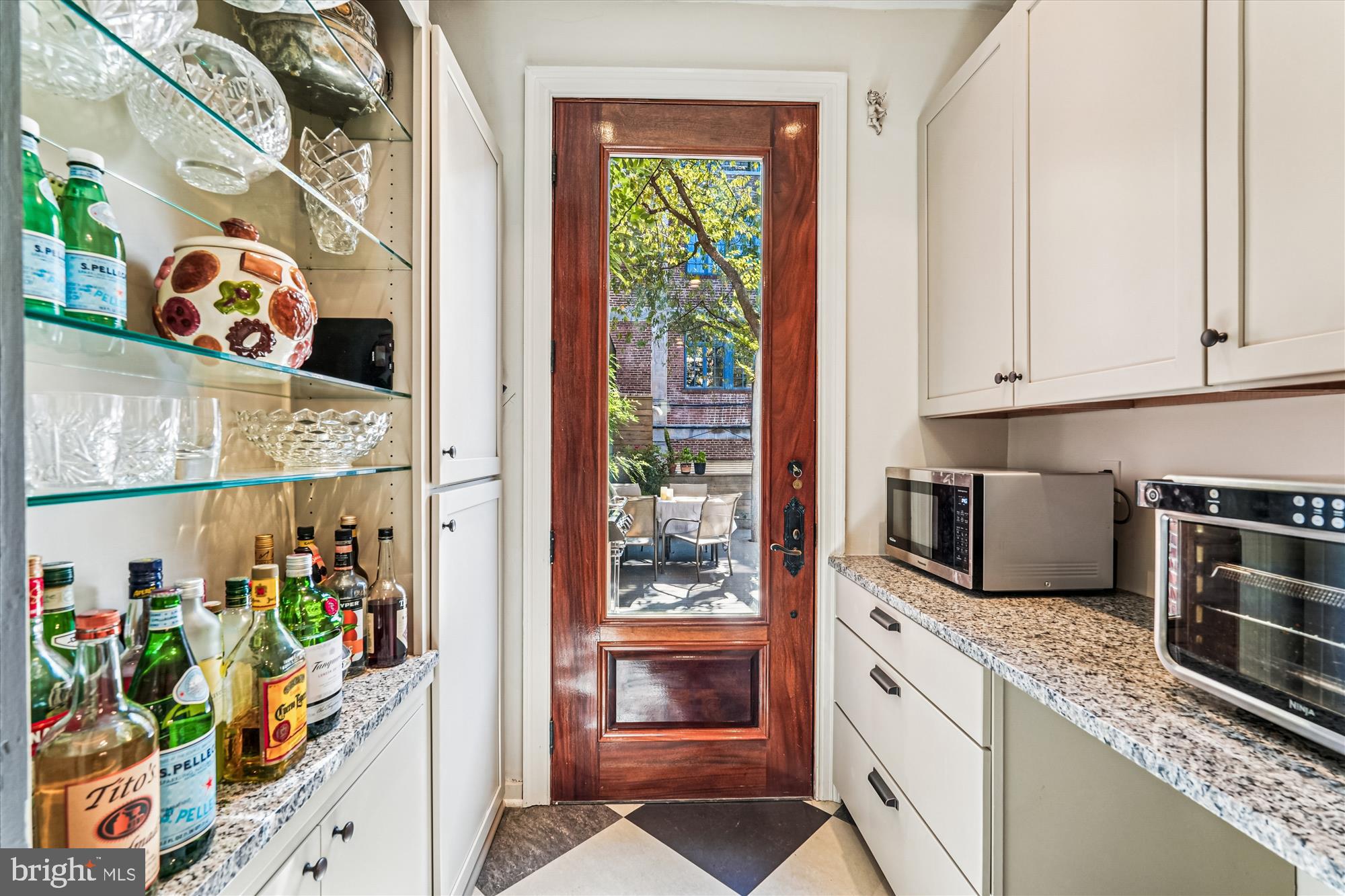 1420 Q Street Northwest Washington, DC 20009 - Photo 18 of 86 a kitchen with stainless steel appliances granite countertop a refrigerator and a stove