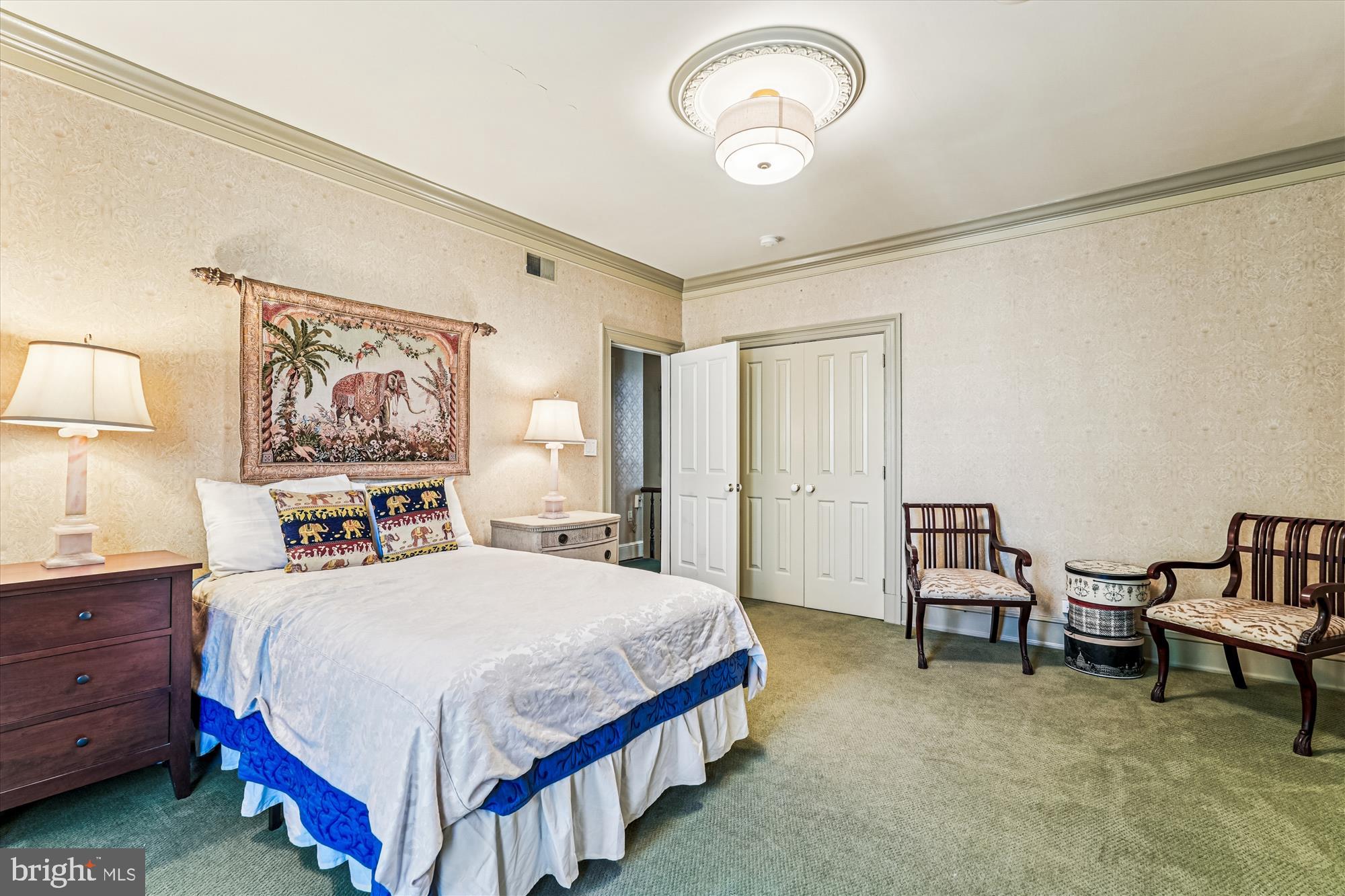 1420 Q Street Northwest Washington, DC 20009 - Photo 51 of 86 a bedroom with a bed and a chandelier