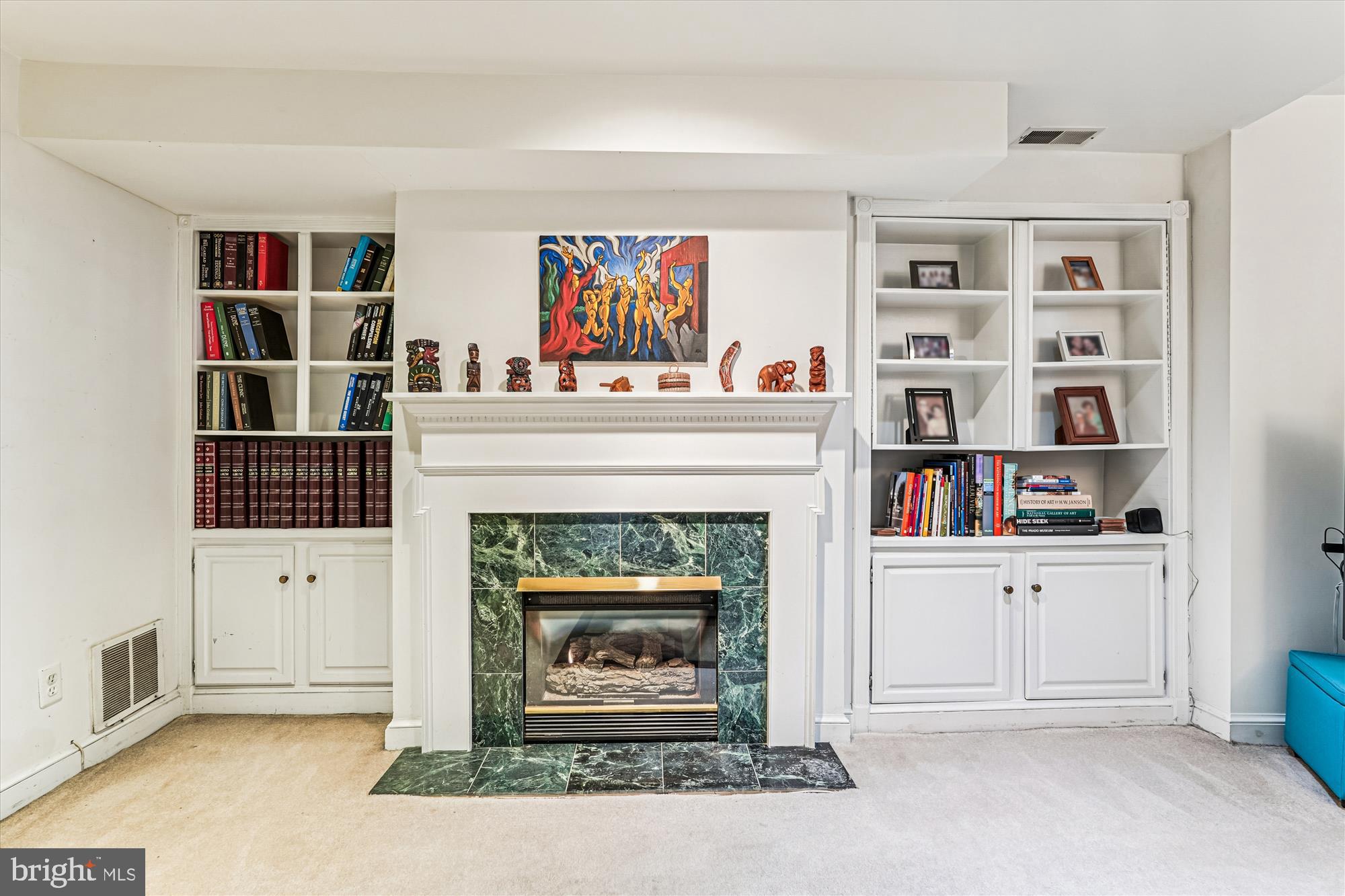 1420 Q Street Northwest Washington, DC 20009 - Photo 54 of 86 a living room with furniture and a fireplace
