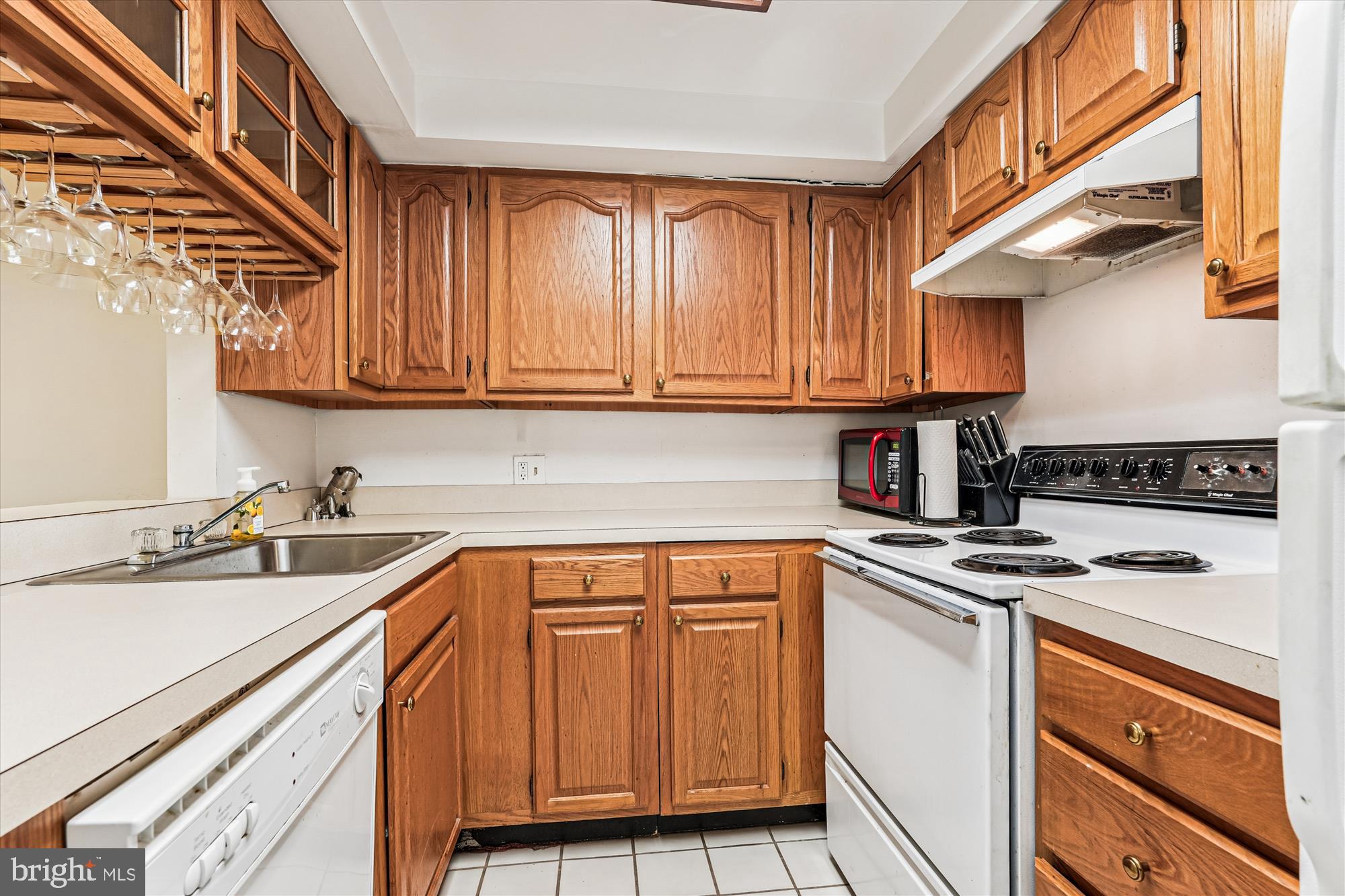 1420 Q Street Northwest Washington, DC 20009 - Photo 58 of 86 a kitchen with stainless steel appliances granite countertop a sink stove and cabinets