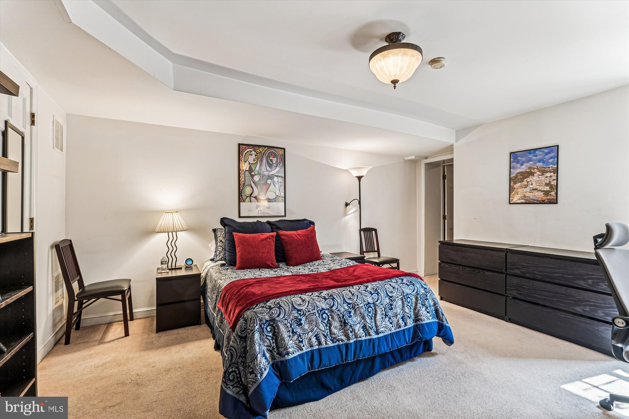 1420 Q Street Northwest Washington, DC 20009 - Photo 59 of 86 a bedroom with a bed and a lamp