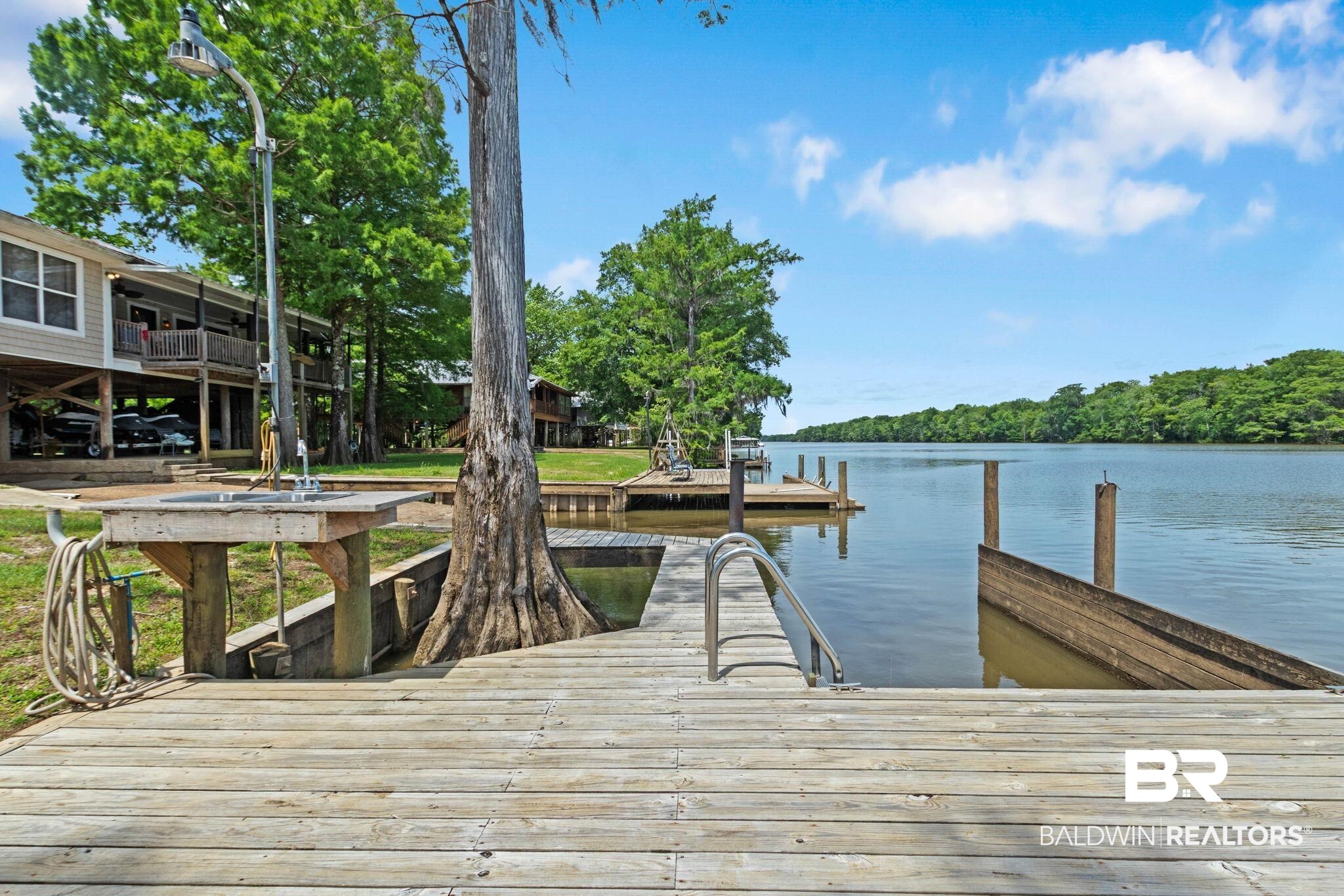 8153 Bryant's Lndg Road Stockton, AL 36579 - Photo 74 of 87 Expansive wooden dock featuring a built-in sink and faucet